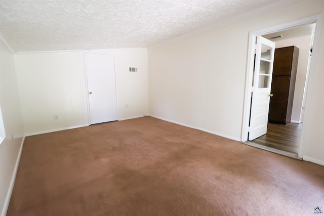431 Alabama Ave, Warner Robins, GA 31093 - unfurnished room with carpet floors and a textured ceiling