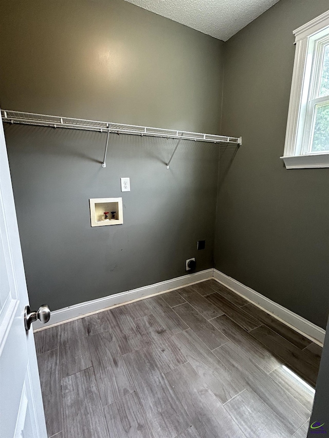 228 Piedmont Ln, Bonaire, GA 31005 - laundry area featuring hookup for an electric dryer, hookup for a washing machine, and wood finished floors