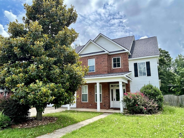 228 Piedmont Ln, Bonaire, GA 31005 - view of front facade with covered porch, brick siding, and roof with shingles