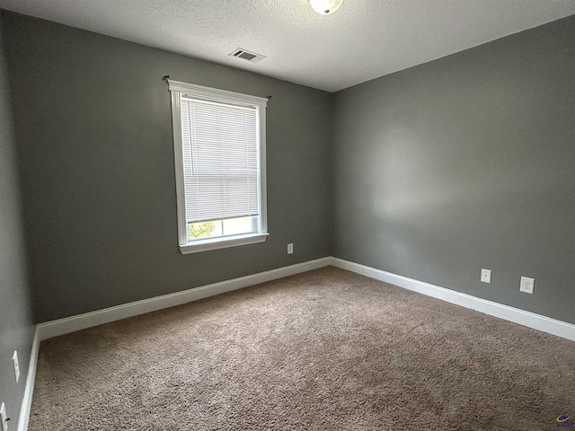 228 Piedmont Ln, Bonaire, GA 31005 - carpeted spare room with baseboards and a textured ceiling