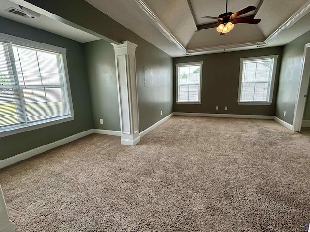 228 Piedmont Ln, Bonaire, GA 31005 - spare room featuring a tray ceiling, a ceiling fan, ornate columns, light carpet, and ornamental molding