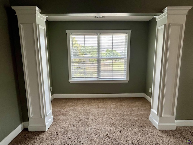 228 Piedmont Ln, Bonaire, GA 31005 - unfurnished bedroom featuring light colored carpet, multiple windows, and ornate columns