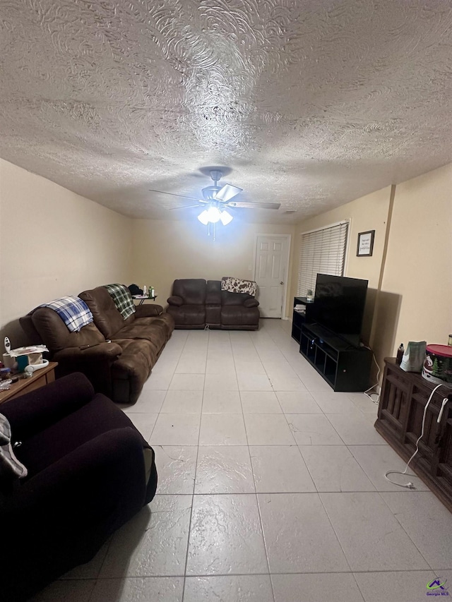 676 N 2nd St, Danville, GA 31017 - tiled living area with ceiling fan and a textured ceiling