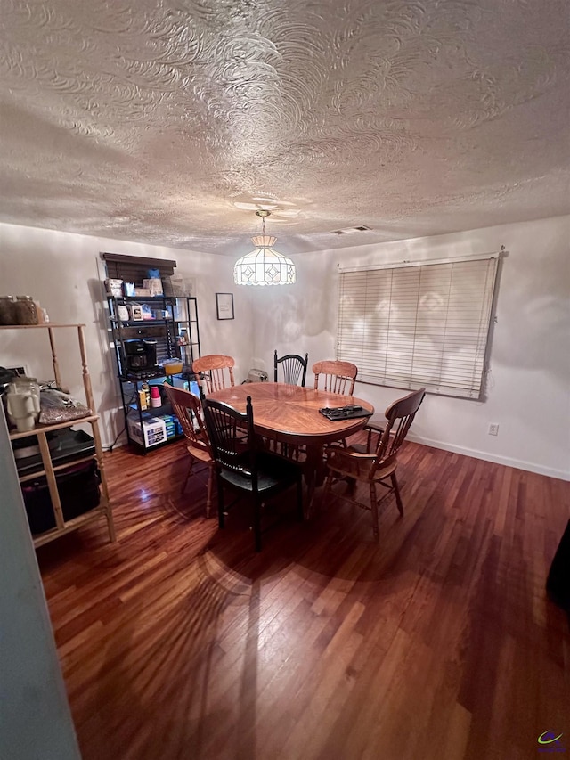 676 N 2nd St, Danville, GA 31017 - dining area featuring wood finished floors and a textured ceiling