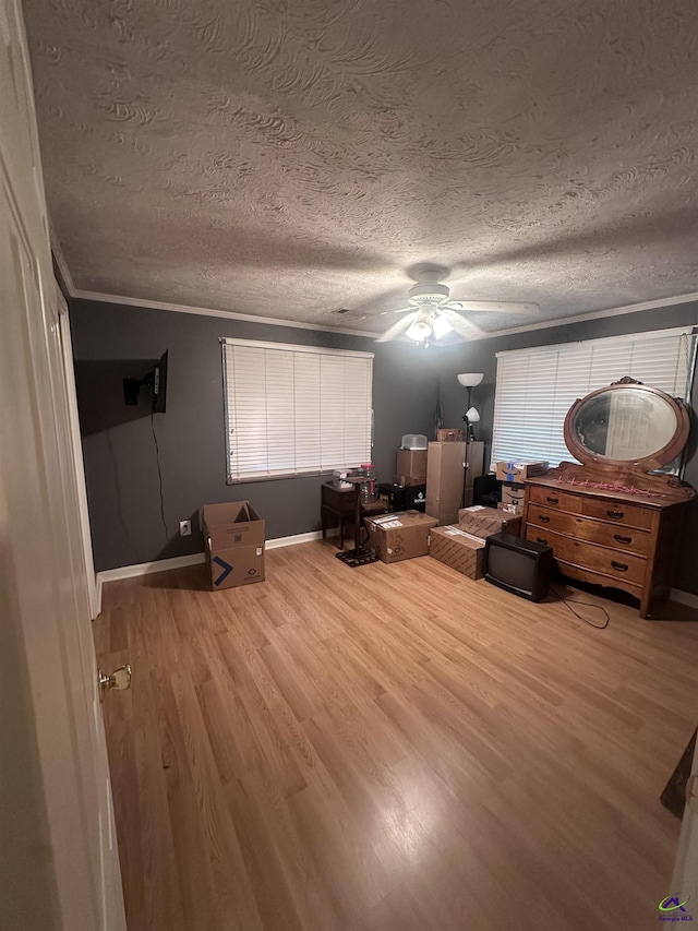 676 N 2nd St, Danville, GA 31017 - bedroom featuring a textured ceiling, wood finished floors, ceiling fan, and crown molding