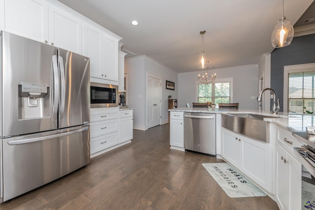 202 Brook Hollow Ct, Kathleen, GA 31047 - kitchen with stainless steel appliances, a chandelier, ornamental molding, dark wood-style floors, and white cabinetry