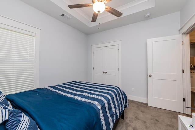 202 Brook Hollow Ct, Kathleen, GA 31047 - bedroom with carpet flooring, a raised ceiling, a closet, and a ceiling fan