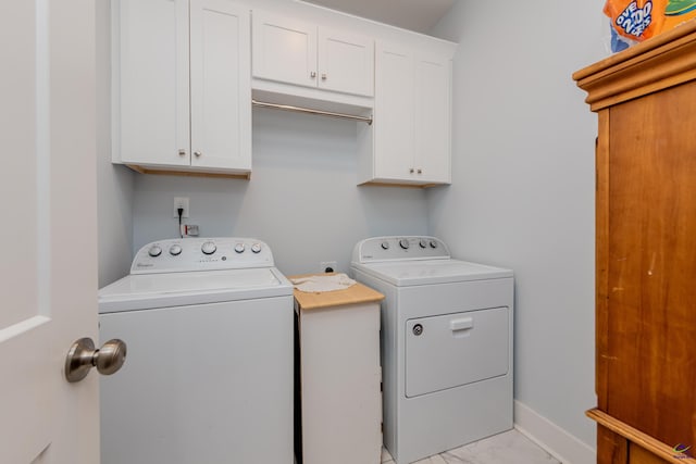 202 Brook Hollow Ct, Kathleen, GA 31047 - laundry room featuring washing machine and clothes dryer, light marble finish flooring, and cabinet space