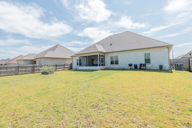 202 Brook Hollow Ct, Kathleen, GA 31047 - rear view of house with a sunroom, a fenced backyard, and brick siding