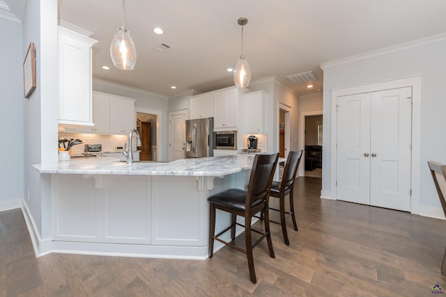 202 Brook Hollow Ct, Kathleen, GA 31047 - kitchen featuring stainless steel fridge with ice dispenser, a peninsula, built in microwave, tasteful backsplash, and white cabinetry