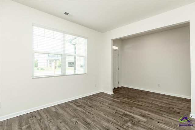 111 Farmers Way, Perry, GA 31069 - spare room featuring dark wood-style floors and plenty of natural light