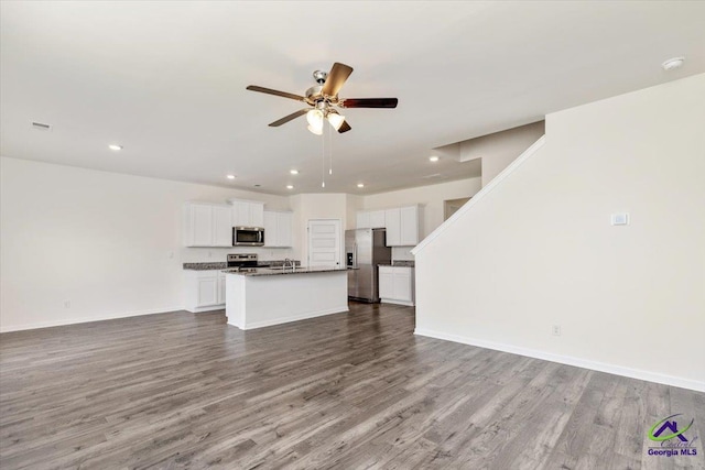 111 Farmers Way, Perry, GA 31069 - unfurnished living room with ceiling fan, wood finished floors, and recessed lighting