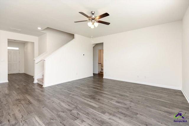 111 Farmers Way, Perry, GA 31069 - empty room with stairway, wood finished floors, and ceiling fan
