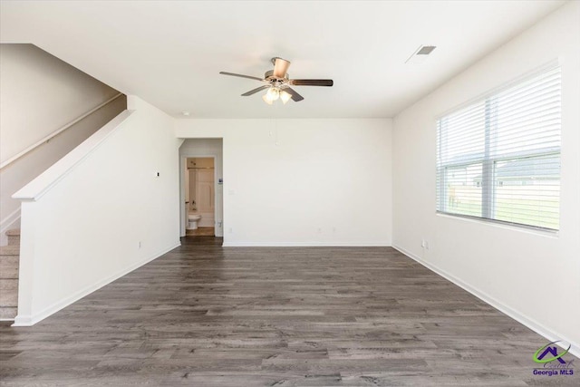 111 Farmers Way, Perry, GA 31069 - unfurnished living room featuring ceiling fan, stairway, and wood finished floors