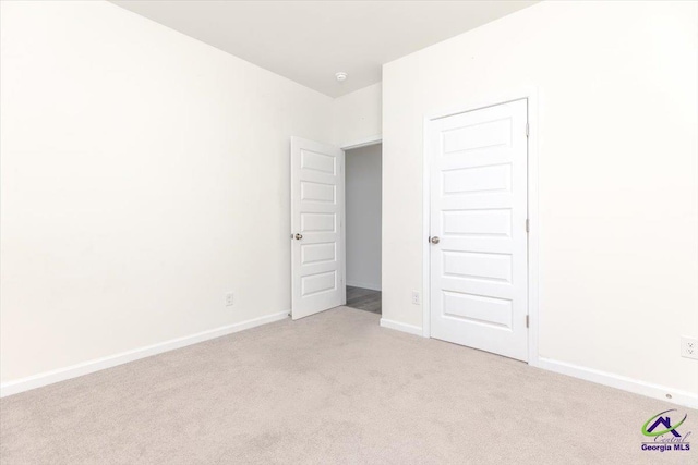 111 Farmers Way, Perry, GA 31069 - unfurnished bedroom featuring light carpet and baseboards