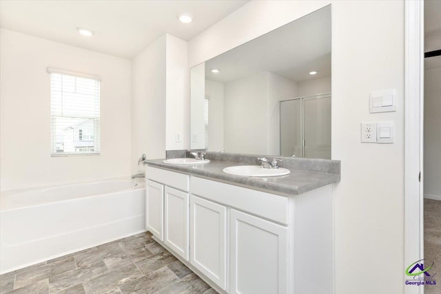 111 Farmers Way, Perry, GA 31069 - bathroom featuring double vanity, a bath, an enclosed shower, and recessed lighting