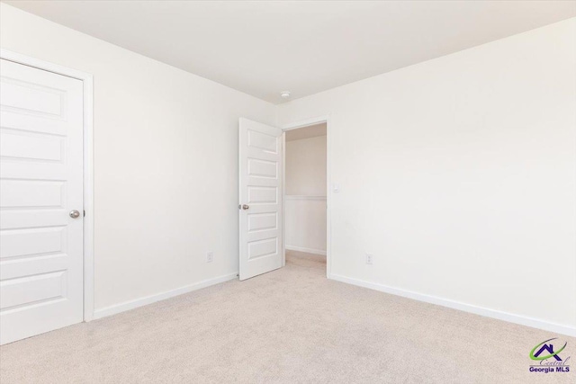 111 Farmers Way, Perry, GA 31069 - spare room featuring light carpet and baseboards