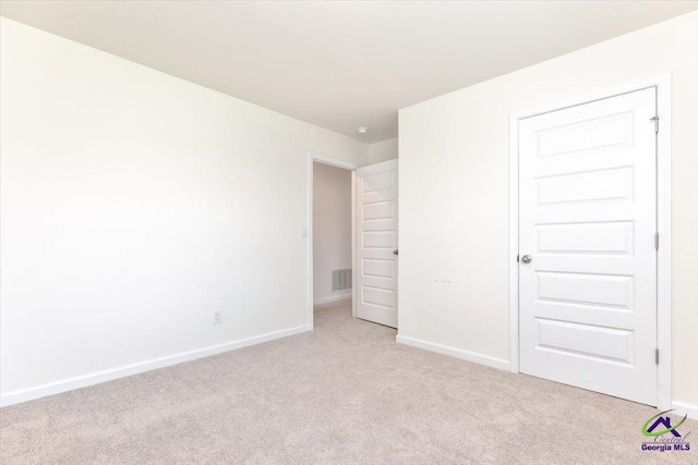 111 Farmers Way, Perry, GA 31069 - unfurnished bedroom with light carpet and baseboards