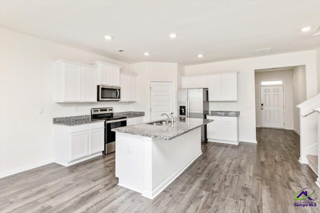 111 Farmers Way, Perry, GA 31069 - kitchen with stainless steel appliances, light wood-type flooring, white cabinetry, and recessed lighting