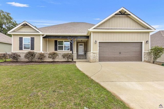 304 Kendall Ct, Perry, GA 31069 - view of front of home featuring brick siding, a garage, a front yard, driveway, and a shingled roof