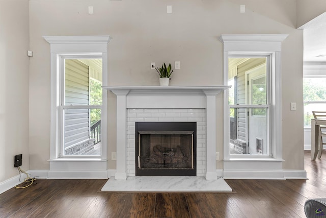 304 Kendall Ct, Perry, GA 31069 - unfurnished living room featuring wood finished floors and a fireplace