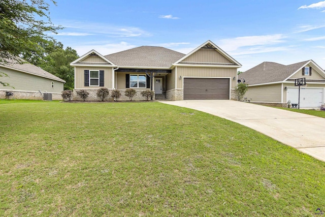 304 Kendall Ct, Perry, GA 31069 - view of front of property featuring concrete driveway, an attached garage, a front yard, and board and batten siding