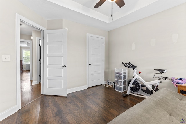 304 Kendall Ct, Perry, GA 31069 - exercise area featuring wood finished floors, ceiling fan, and a raised ceiling