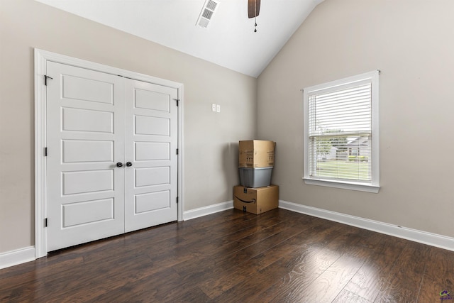 304 Kendall Ct, Perry, GA 31069 - unfurnished bedroom featuring dark wood-style flooring, lofted ceiling, a closet, and a ceiling fan