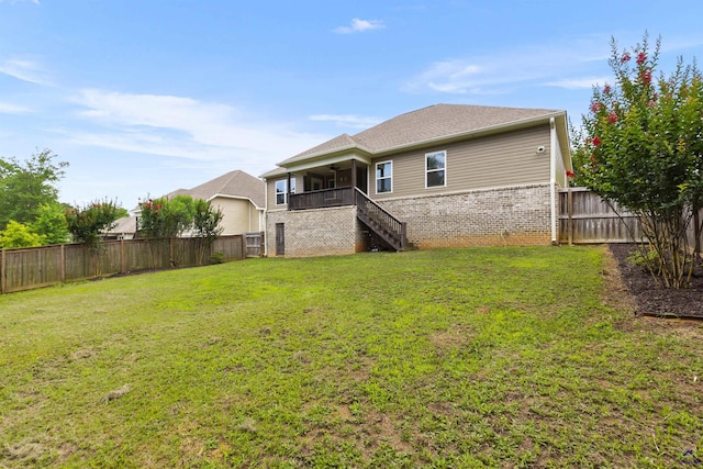 304 Kendall Ct, Perry, GA 31069 - rear view of property with stairs, brick siding, ceiling fan, and a fenced backyard