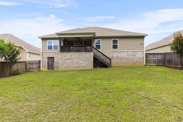 304 Kendall Ct, Perry, GA 31069 - back of house featuring a ceiling fan, stairway, brick siding, a fenced backyard, and roof with shingles