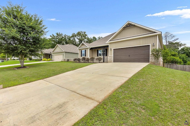 304 Kendall Ct, Perry, GA 31069 - view of front facade with an attached garage, driveway, and a shingled roof