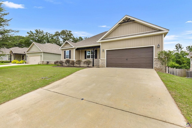 304 Kendall Ct, Perry, GA 31069 - view of front of house with brick siding, a garage, and driveway
