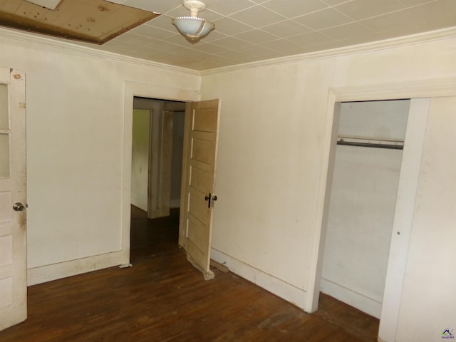 9533 US Highway 80 W, Culloden, GA 31016 - unfurnished bedroom featuring crown molding, wood finished floors, and a closet
