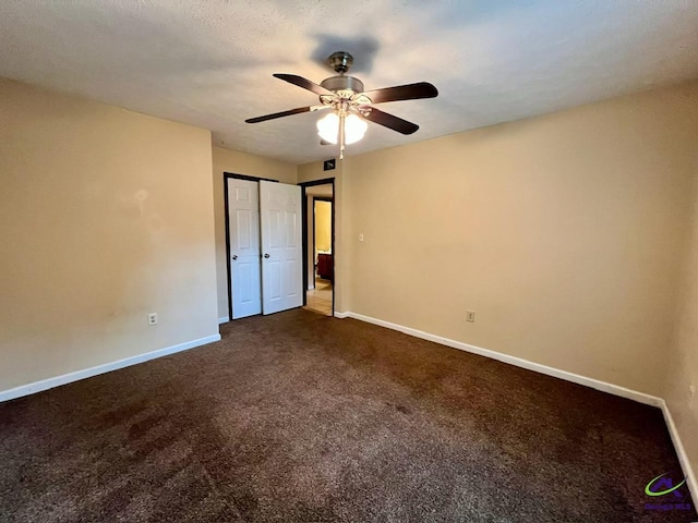 102 Overlook Dr, Warner Robins, GA 31088 - unfurnished bedroom with dark carpet and a ceiling fan