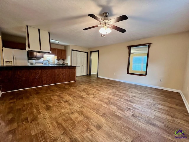 102 Overlook Dr, Warner Robins, GA 31088 - unfurnished living room with wood finished floors and a ceiling fan