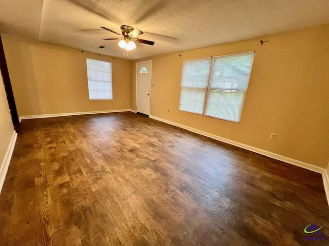 102 Overlook Dr, Warner Robins, GA 31088 - spare room with a ceiling fan, a textured ceiling, and dark wood-style flooring