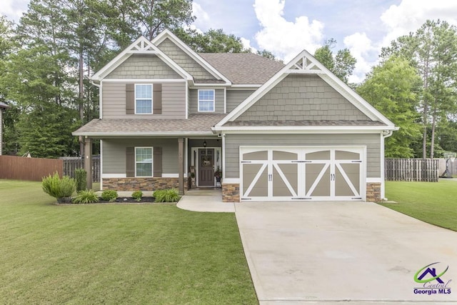 501 Adirondac Way, Bonaire, GA 31005 - craftsman-style home with stone siding, concrete driveway, roof with shingles, an attached garage, and a porch