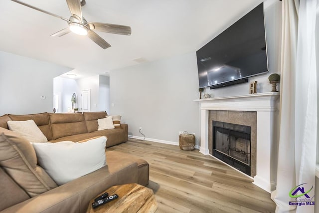 501 Adirondac Way, Bonaire, GA 31005 - living room with wood finished floors, a tiled fireplace, and ceiling fan