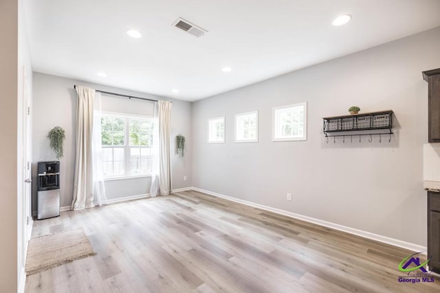 501 Adirondac Way, Bonaire, GA 31005 - unfurnished living room featuring light wood finished floors and recessed lighting
