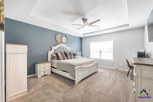501 Adirondac Way, Bonaire, GA 31005 - bedroom with a tray ceiling, light carpet, and a ceiling fan