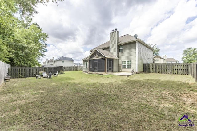 501 Adirondac Way, Bonaire, GA 31005 - rear view of property with a sunroom, a chimney, a fenced backyard, and a shingled roof