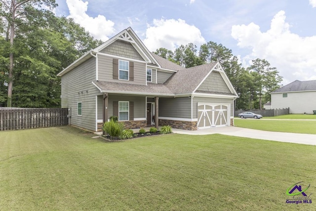 501 Adirondac Way, Bonaire, GA 31005 - craftsman house with driveway, stone siding, an attached garage, and a shingled roof