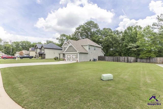 501 Adirondac Way, Bonaire, GA 31005 - view of yard with concrete driveway and a garage