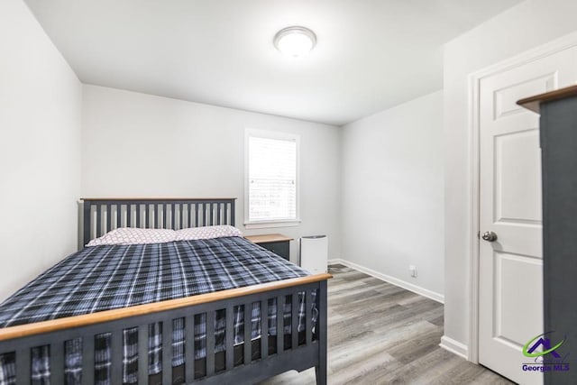 4450 Massey Rd, Macon, GA 31206 - bedroom featuring wood finished floors and baseboards
