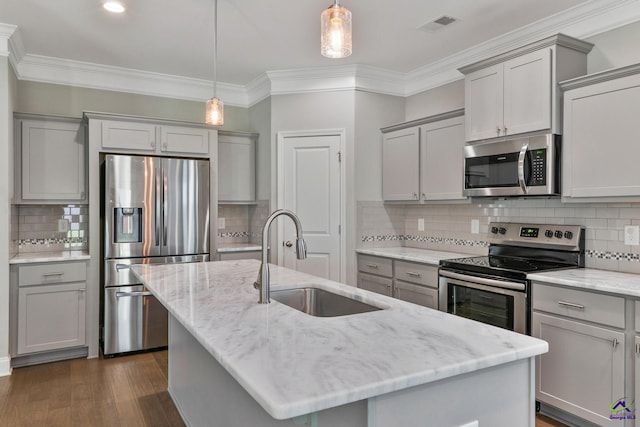 104 Taylor Leigh Ct, Kathleen, GA 31047 - kitchen with stainless steel appliances, gray cabinets, decorative backsplash, ornamental molding, and a center island with sink