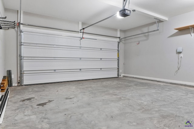 104 Taylor Leigh Ct, Kathleen, GA 31047 - garage with a garage door opener and baseboards