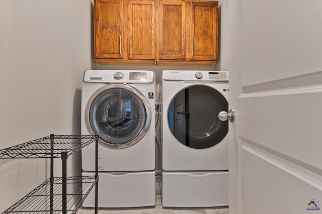 104 Taylor Leigh Ct, Kathleen, GA 31047 - washroom with washing machine and clothes dryer and cabinet space