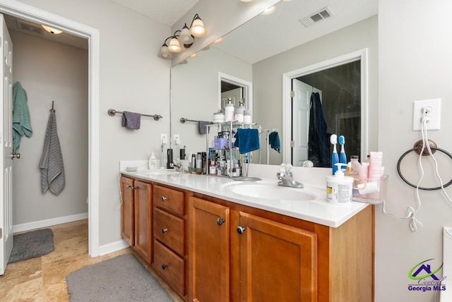 222 Duke Ln, Kathleen, GA 31047 - bathroom with double vanity and baseboards