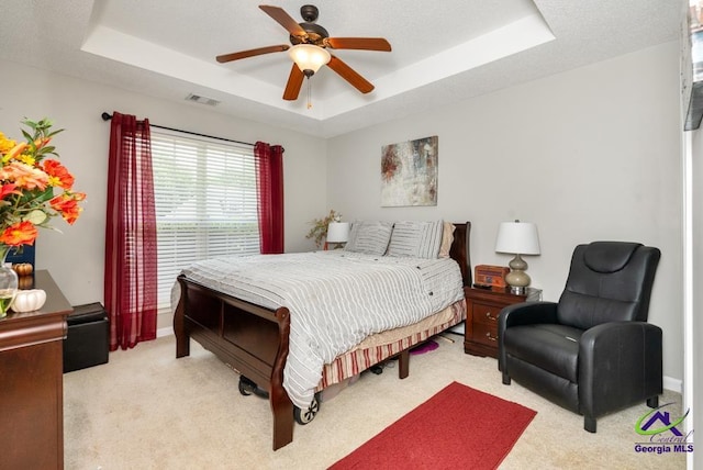 222 Duke Ln, Kathleen, GA 31047 - bedroom featuring a raised ceiling, light carpet, and ceiling fan