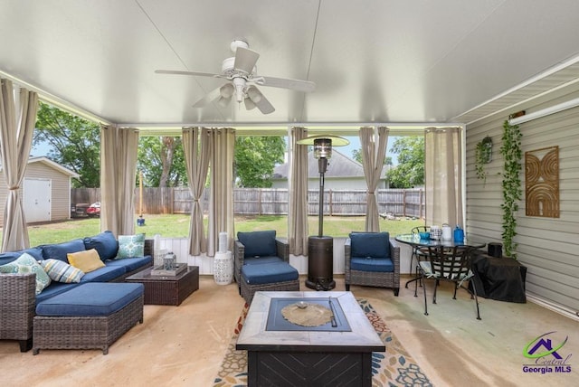 222 Duke Ln, Kathleen, GA 31047 - sunroom / solarium with an outdoor living space with a fire pit, ceiling fan, and plenty of natural light